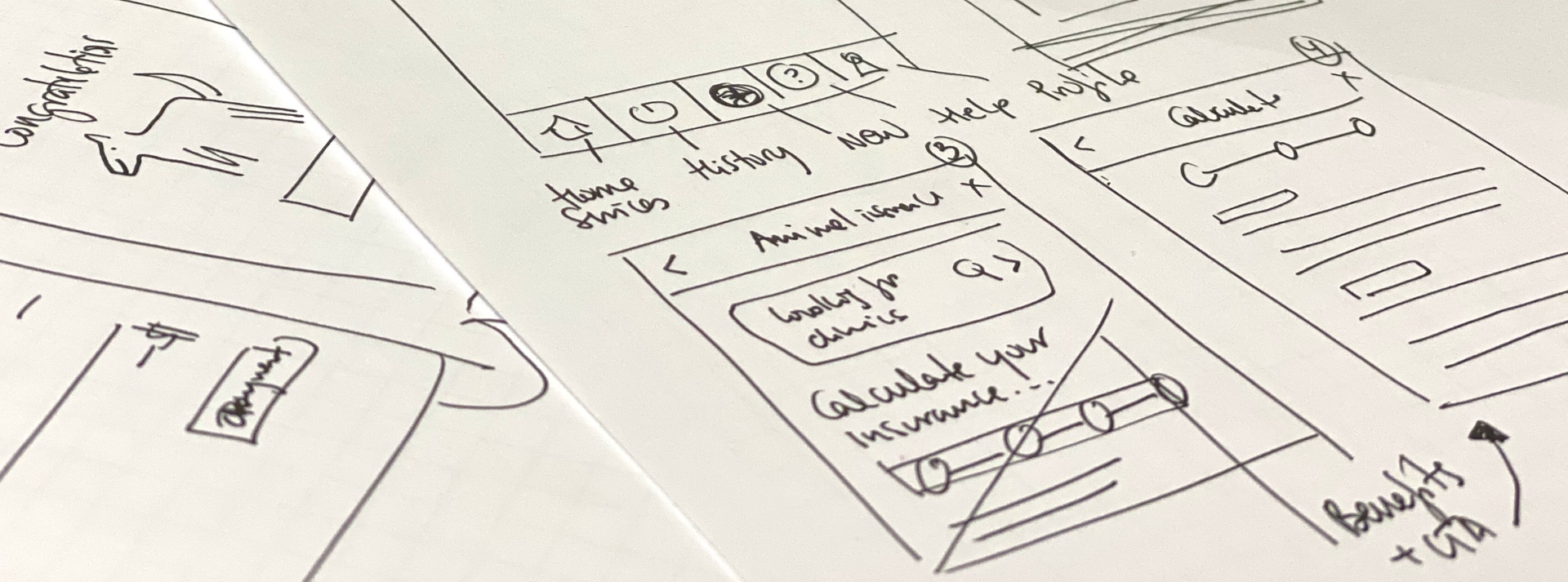 Low-fidelity wireframe sketches on paper